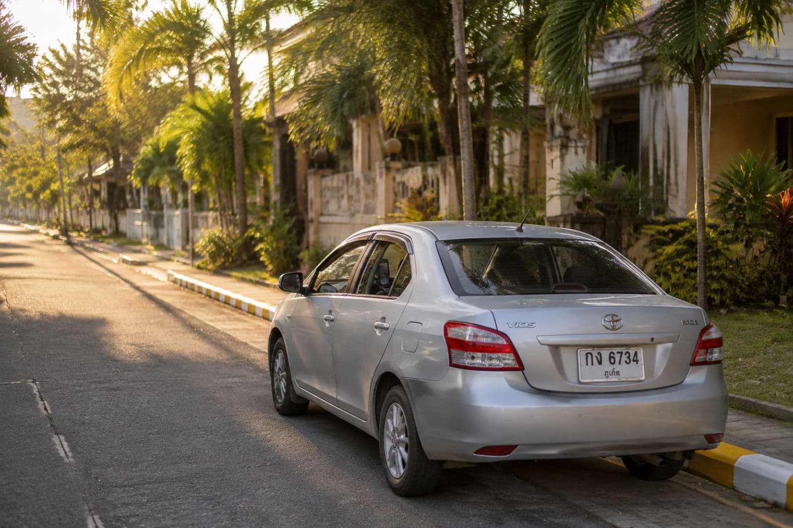 Toyota Vios parked on a quiet Phuket residential street